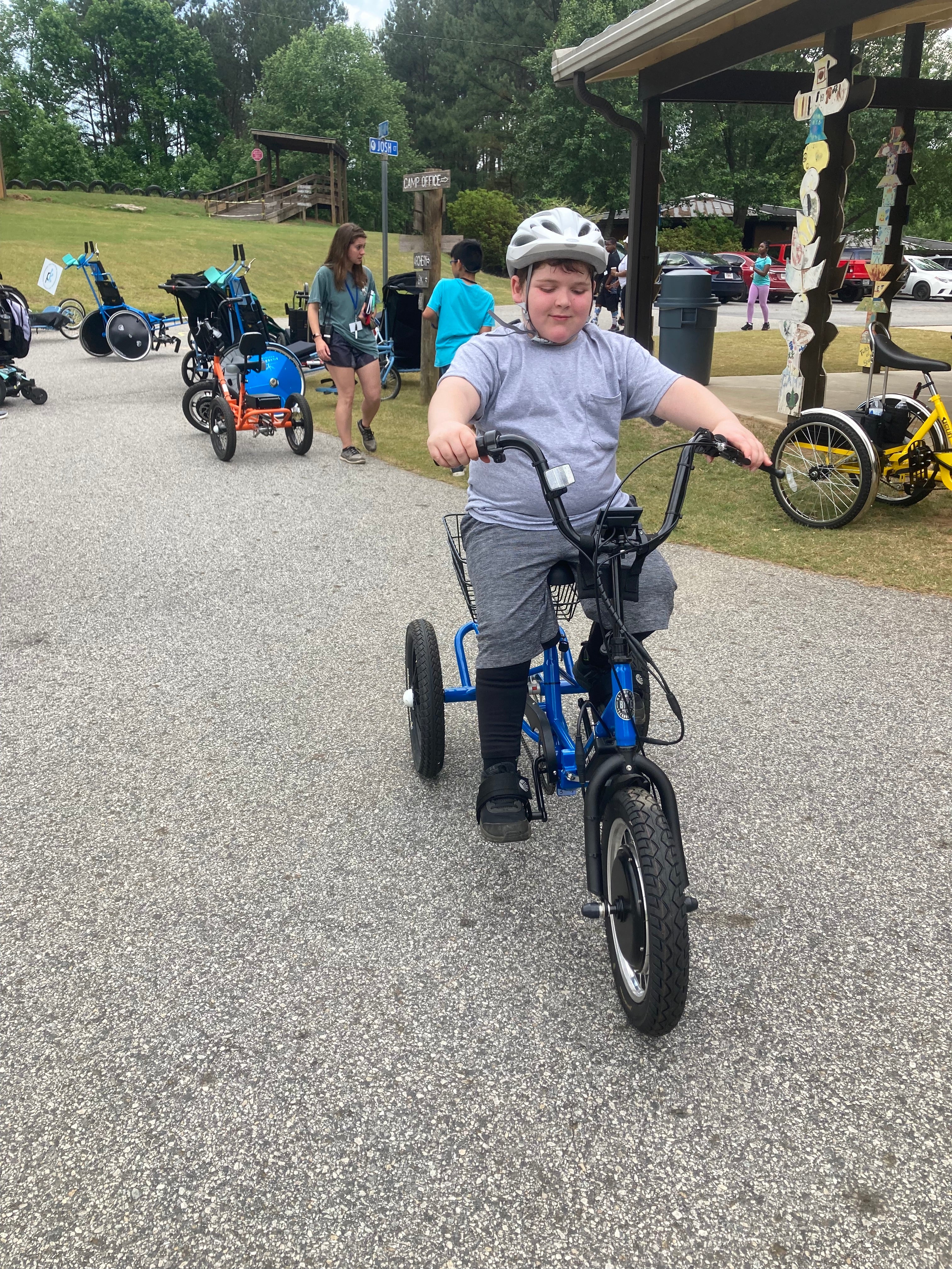 All smiles on the Liberty Trike at Camp Twin Lakes