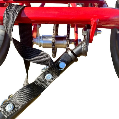 The trailer arm easily connects to the Liberty Trike trailer tab located under the battery.